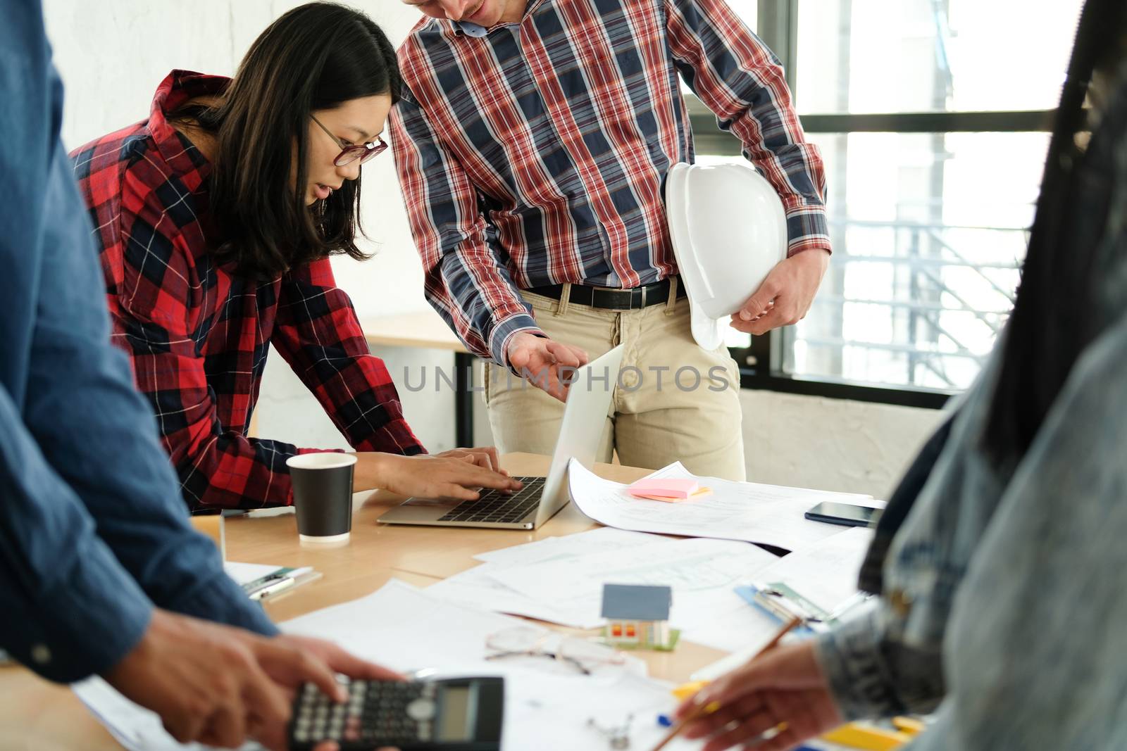 architect engineer interior designer team working discussing on house blueprint of real estate project in meeting. building construction teamwork concept