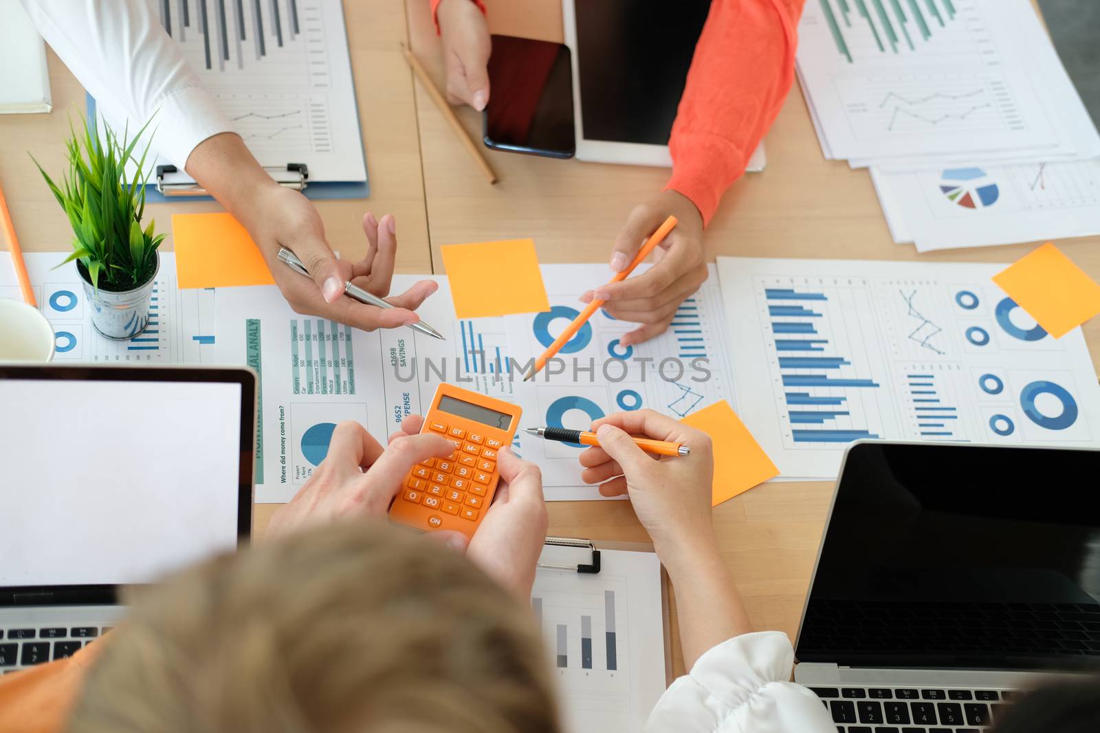 business people discussing on performance revenue in meeting. businessman working with co-worker team. financial adviser analyzing data with investor.