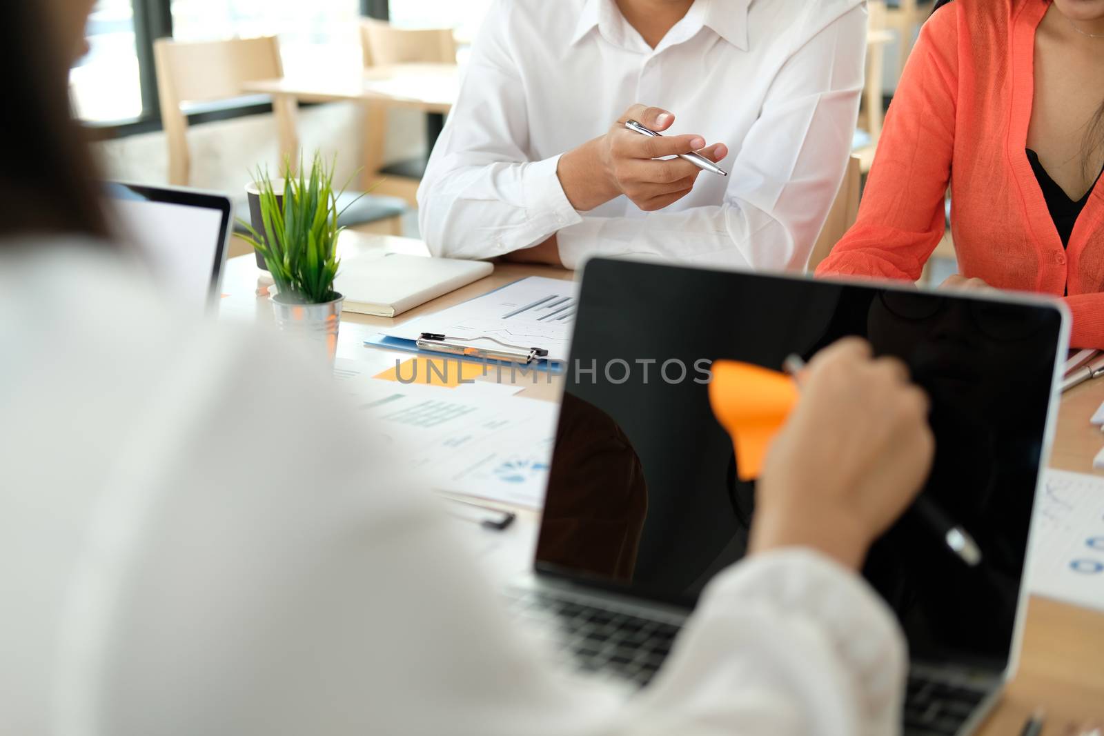 business people discussing on performance revenue in meeting. businessman working with co-worker team. financial adviser analyzing data with investor.