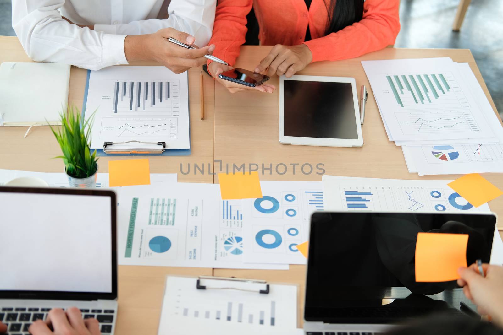 business people discussing on performance revenue in meeting. businessman working with co-worker team. financial adviser analyzing data with investor.