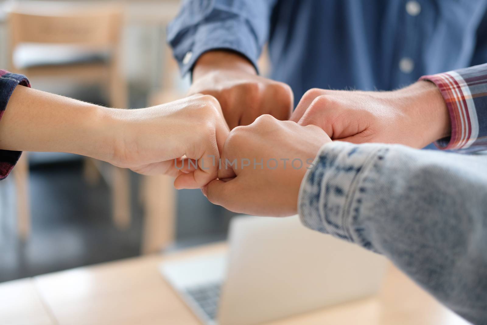 startup man woman joining united hand, business team touching hands together after complete a deal in meeting. unity teamwork partnership corporate concept.