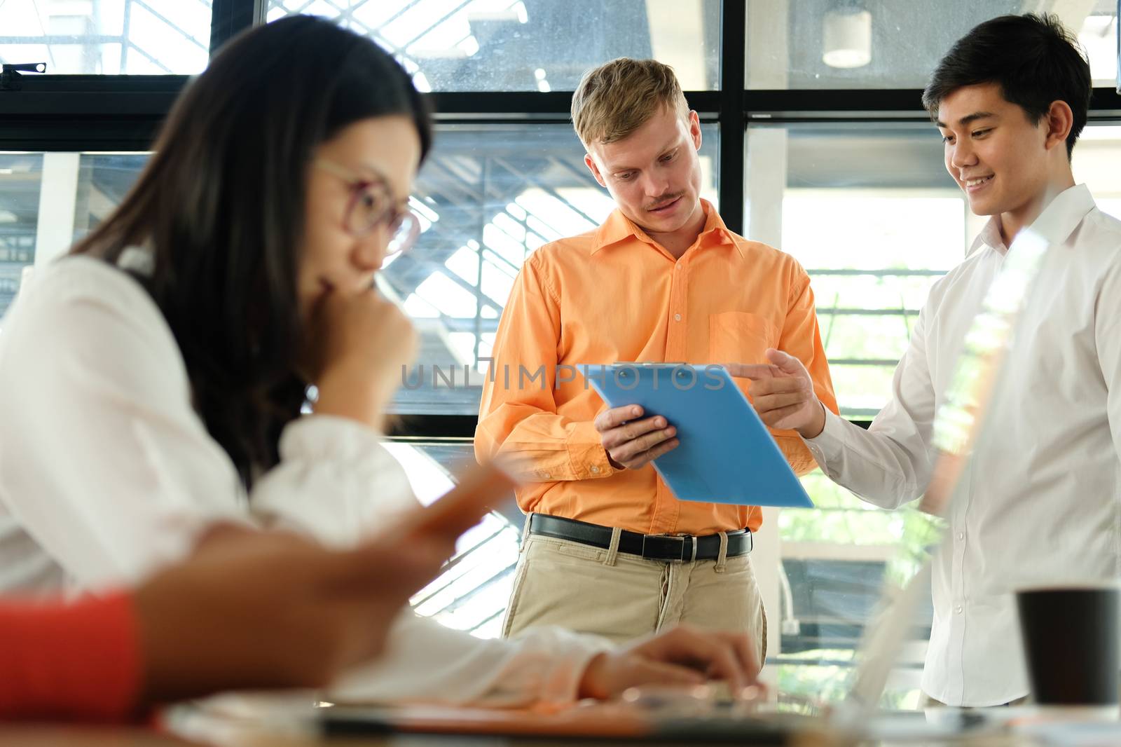 business people discussing on performance revenue in meeting. businessman working with co-worker team. financial adviser analyzing data with investor.