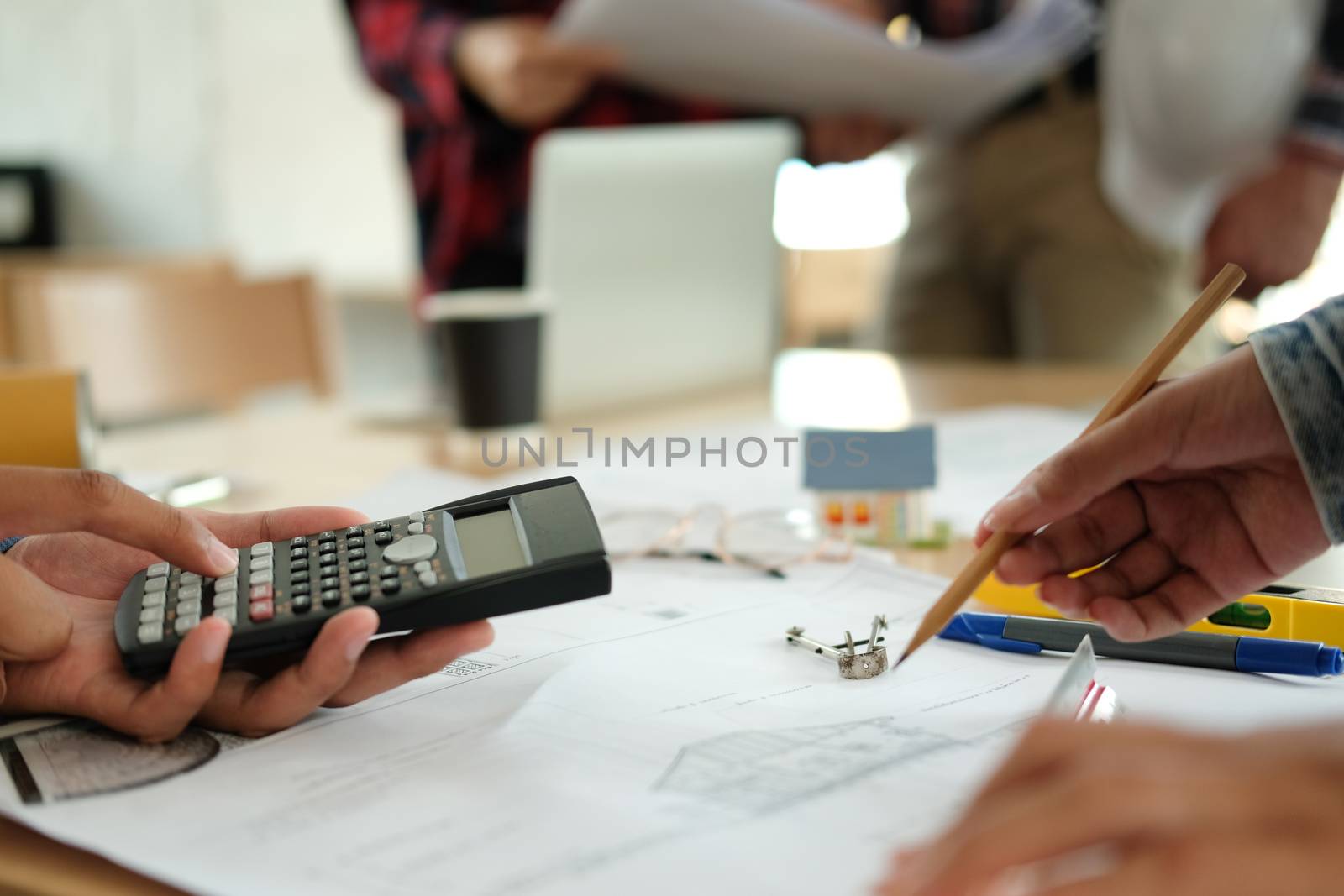 architect engineer interior designer team working discussing on house blueprint of real estate project in meeting. building construction teamwork concept