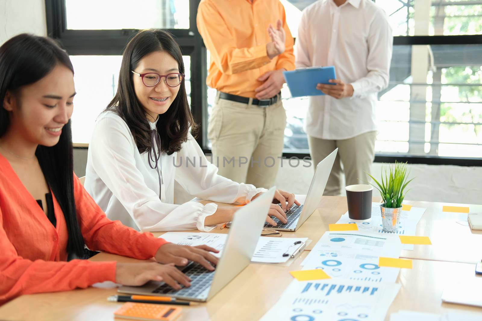 business people discussing on performance revenue in meeting. businessman working with co-worker team. financial adviser analyzing data with investor.