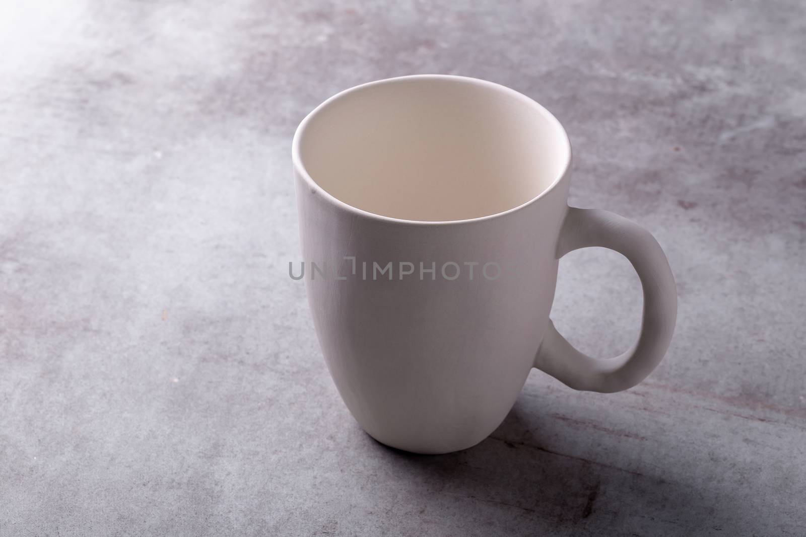 Empty blank white ceramic cup on Cement Board by kaiskynet