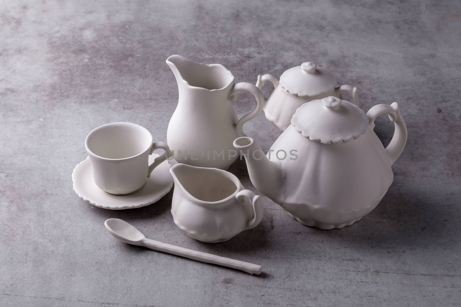 Teapot creamer, Cup and saucer on Cement Board by kaiskynet