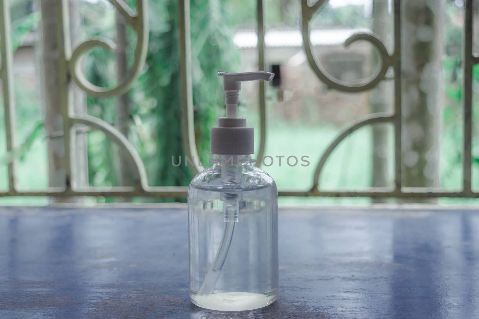 A Refillable Transparent Empty Hand Washing Sanitizer pump Glass Bottle Container To store Liquid cream Shampoo or Soap dispenser. Health care and medical object. Still life.