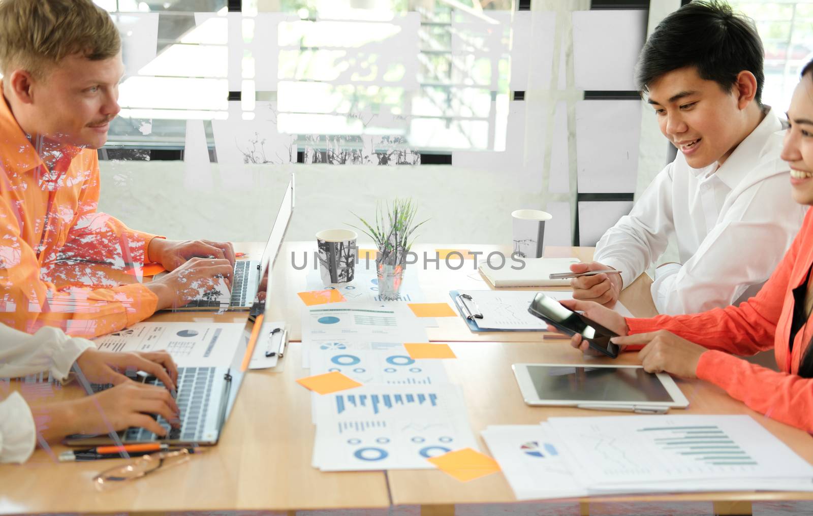 business people discussing on performance revenue in meeting. businessman working with co-worker team. financial adviser analyzing data with investor.