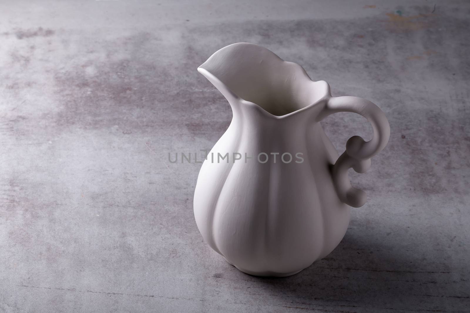 Teapot creamer, Cup and saucer on Cement Board.