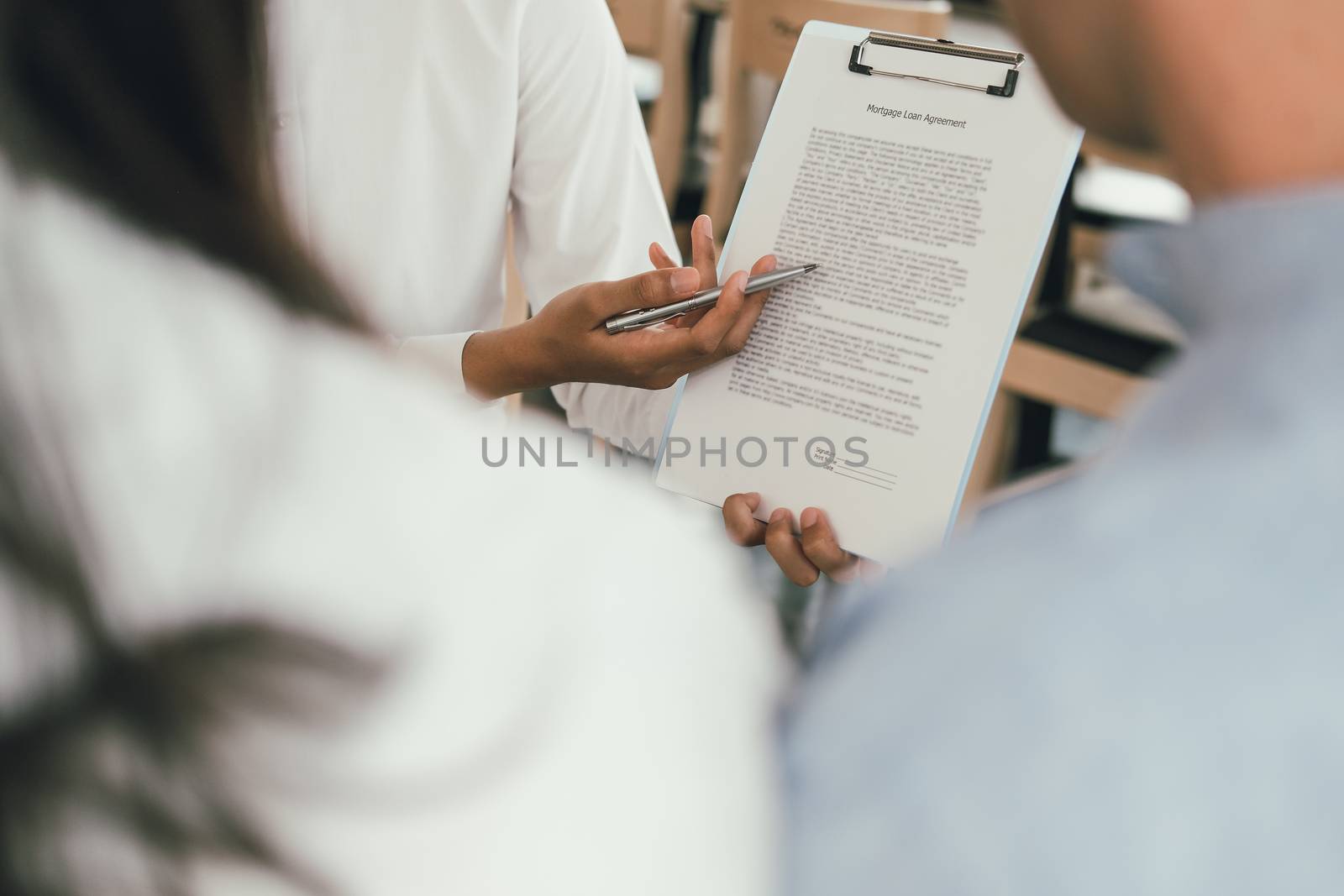 couple consulting lawyer about contract. insurance broker financial advisor giving legal advice to customer. law & investment concept