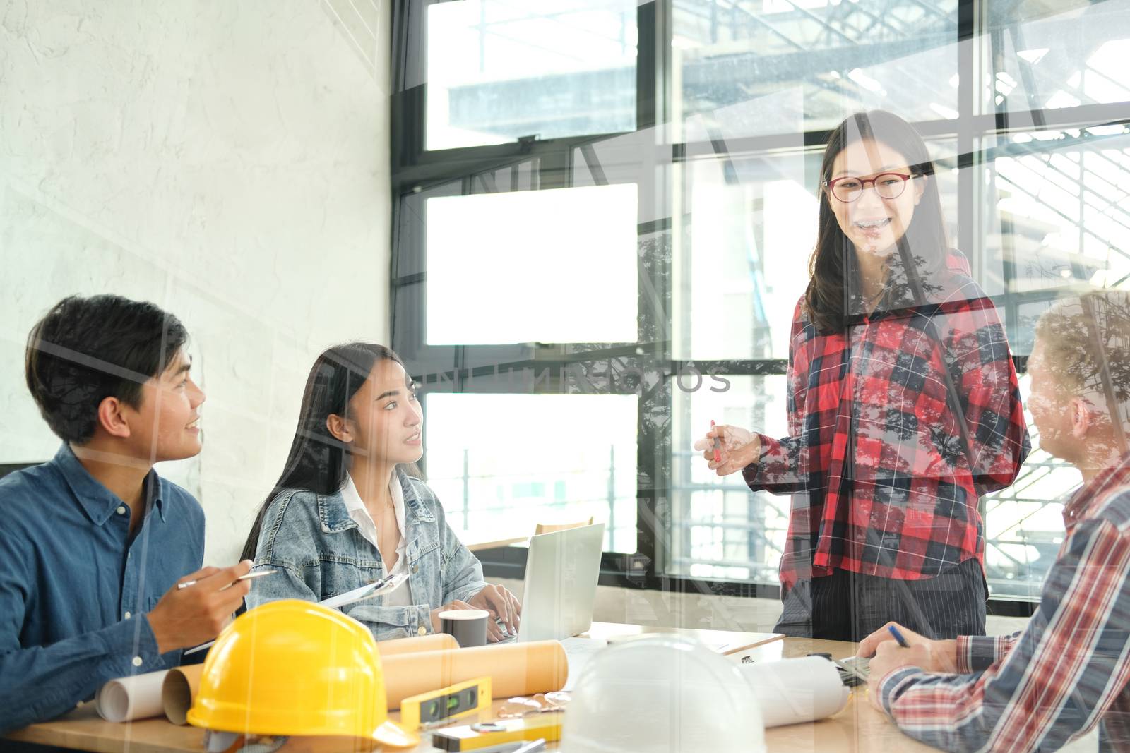 architect engineer interior designer team working discussing on house blueprint of real estate project in meeting. building construction teamwork concept