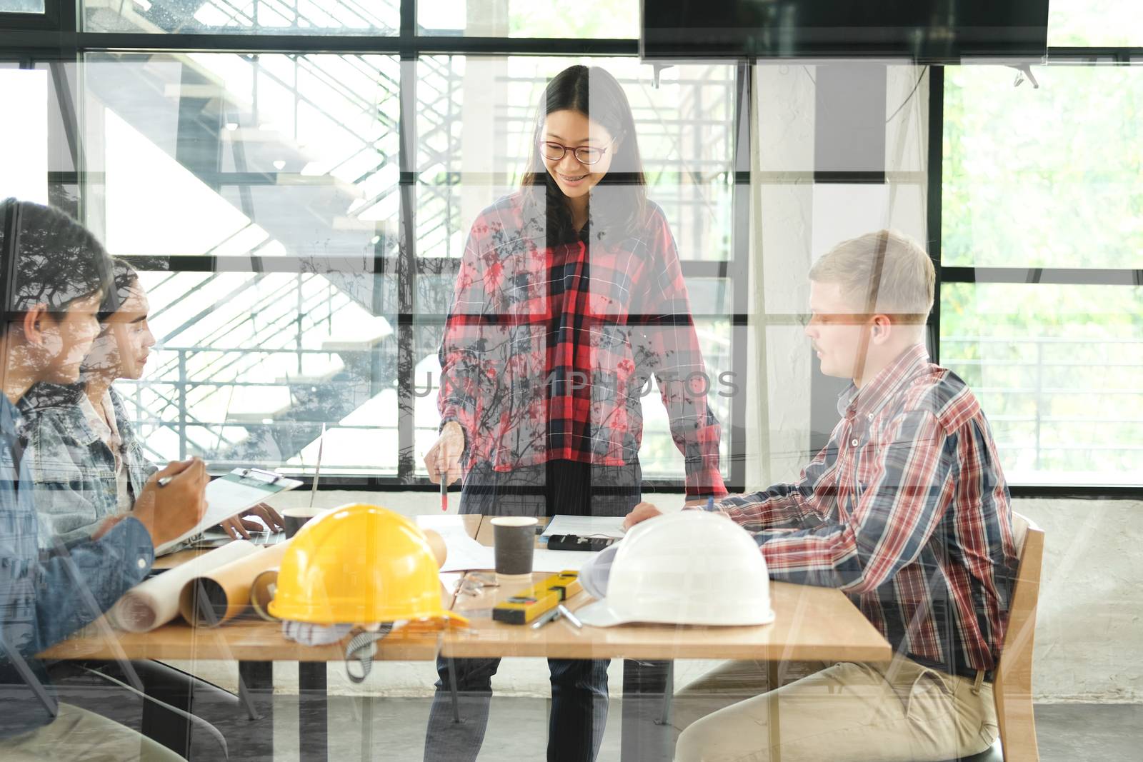 architect engineer interior designer team working discussing on house blueprint of real estate project in meeting. building construction teamwork concept