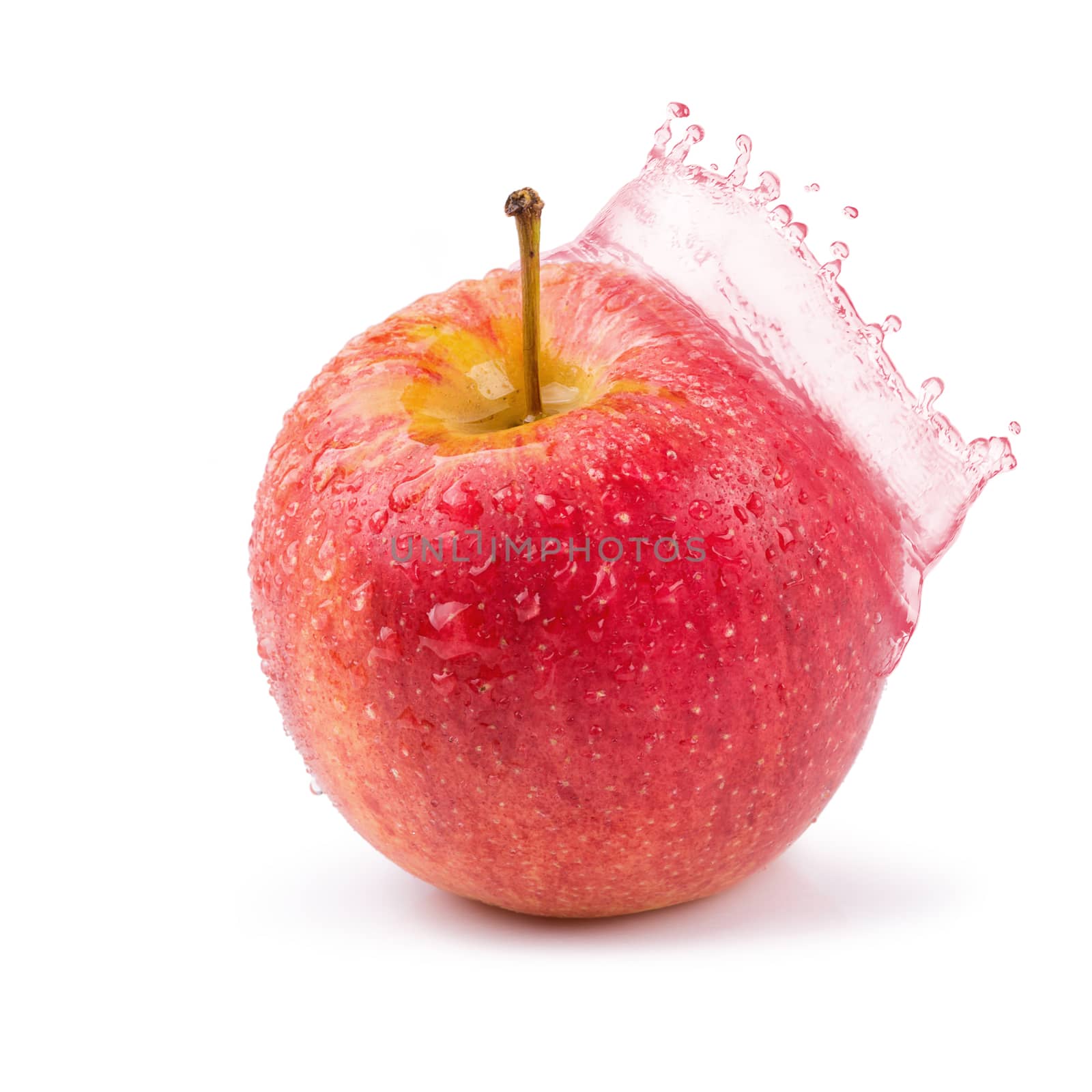 Red apples and apples juice splashing isolated on a white background.