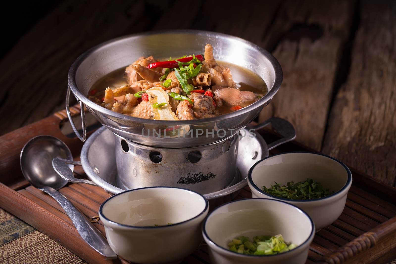 Chicken and herb soup in pot.