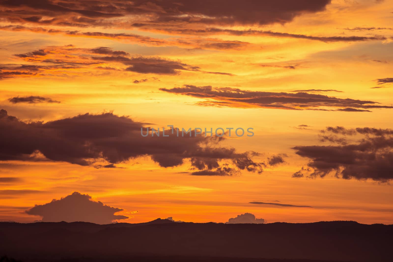 Colorful dramatic sky with cloud at sunset.Sky with sun backgrou by kaiskynet