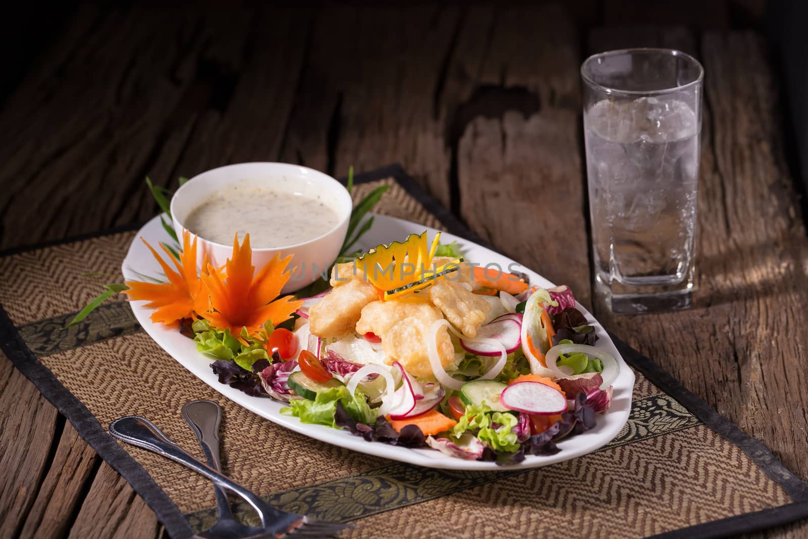 Fried fish and vegetable salad.