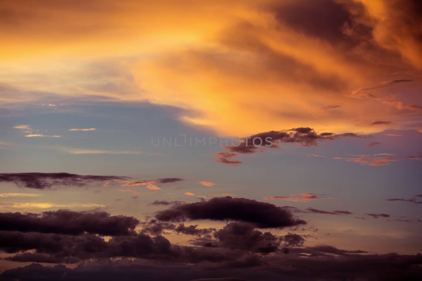 Colorful dramatic sky with cloud at sunset.Sky with sun background.