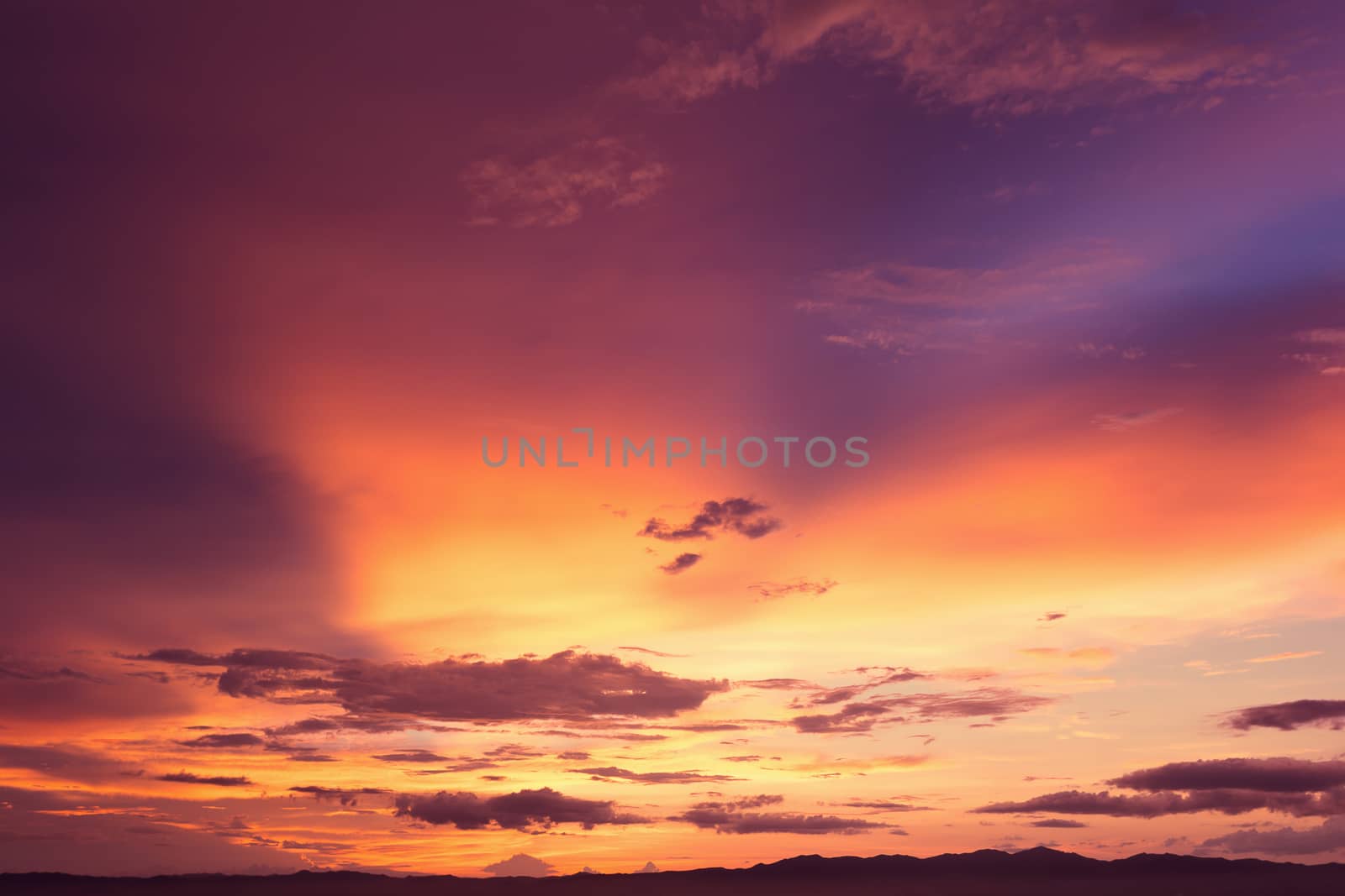 Colorful dramatic sky with cloud at sunset.Sky with sun background.