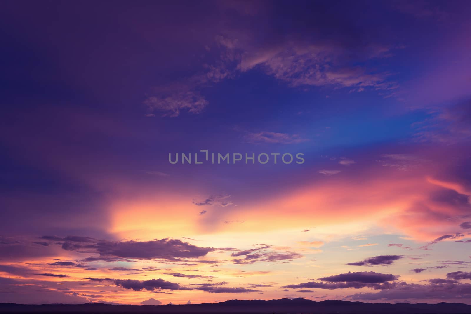 Colorful dramatic sky with cloud at sunset.Sky with sun background.