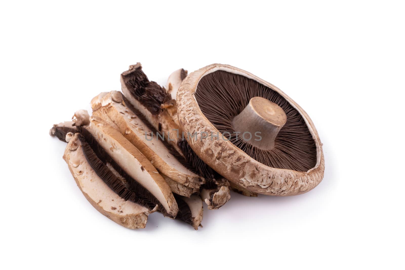 Portobello mushrooms and slice isolated on a white background.