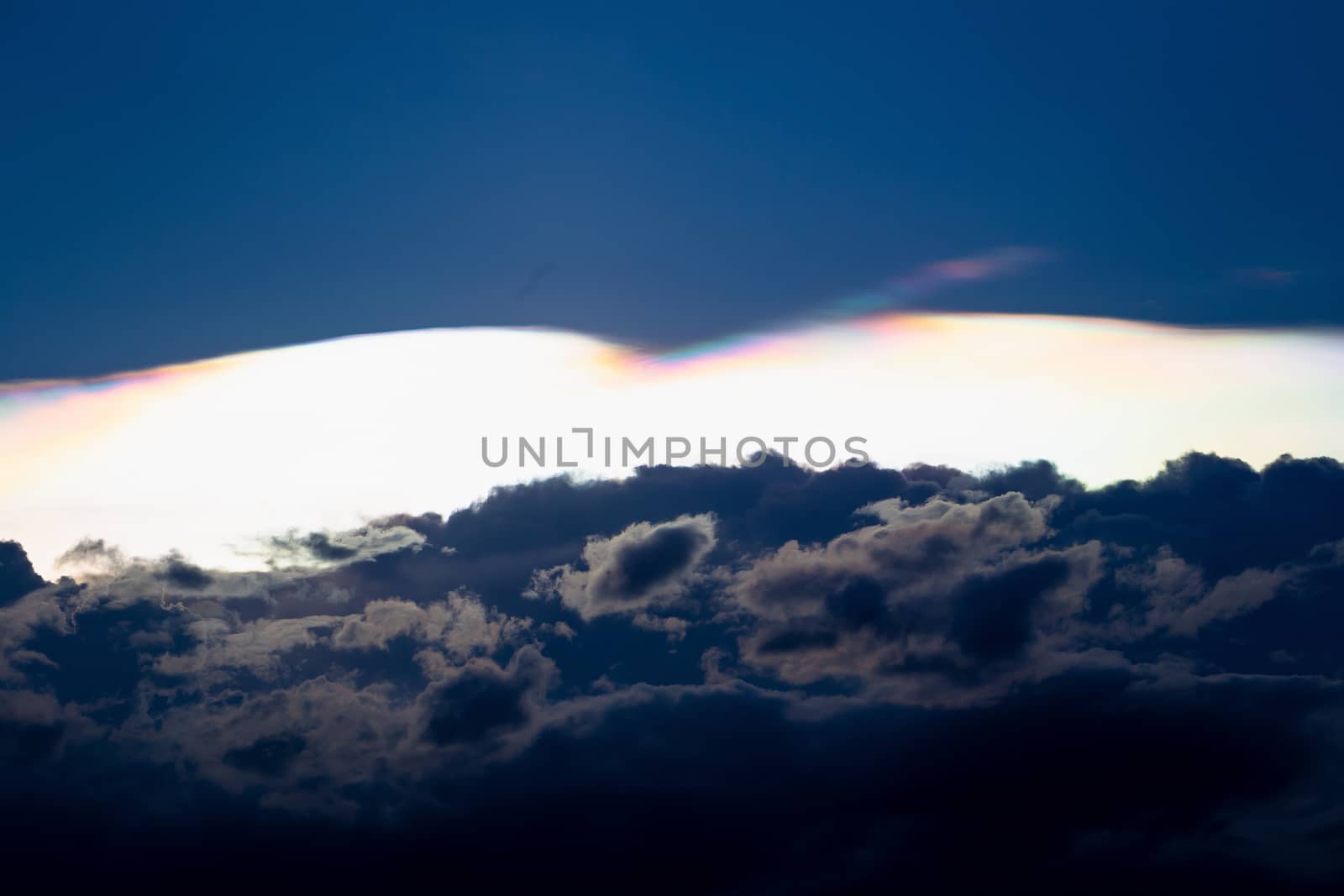 Cloud iridescence, diffraction phenomenon produce very vivid color and make cloud shine like a corona.