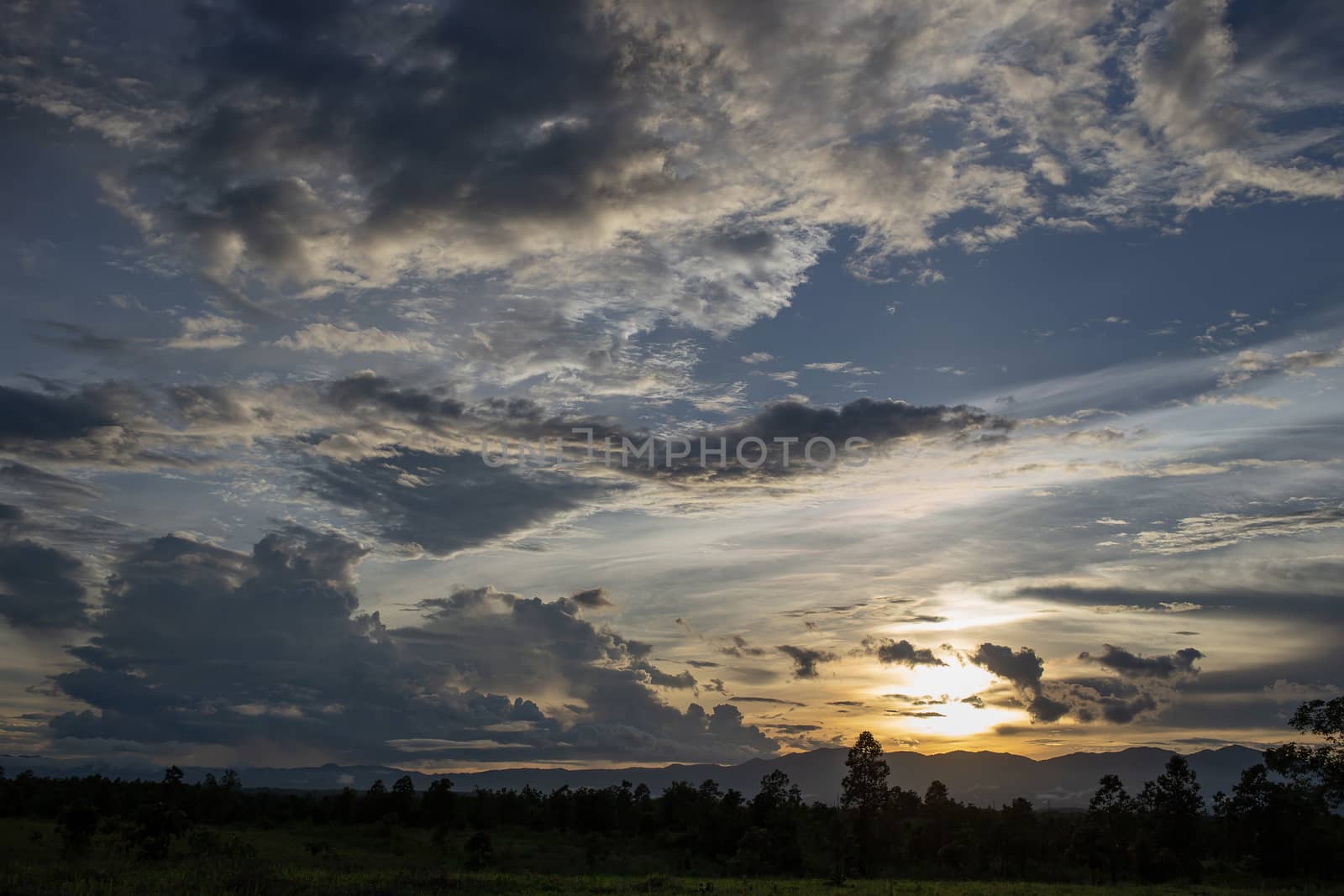 Colorful dramatic sky with cloud at sunset.