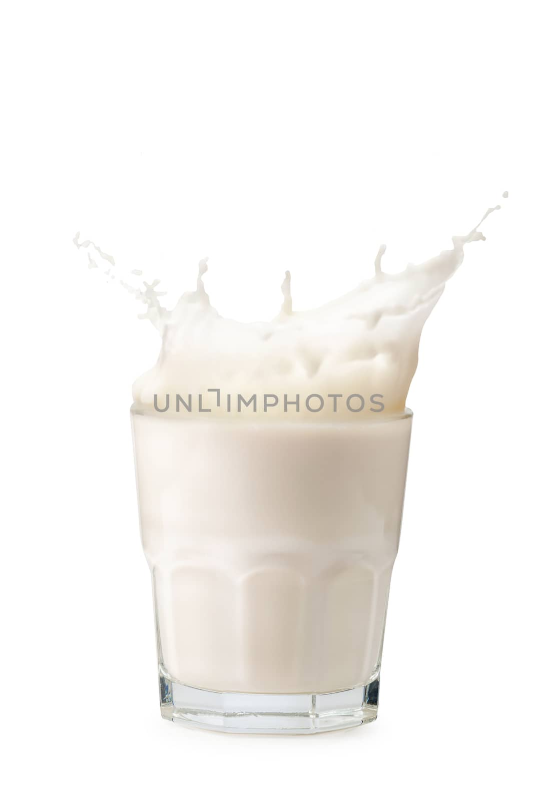 Splashes of milk from the glass isolated on white background by kaiskynet