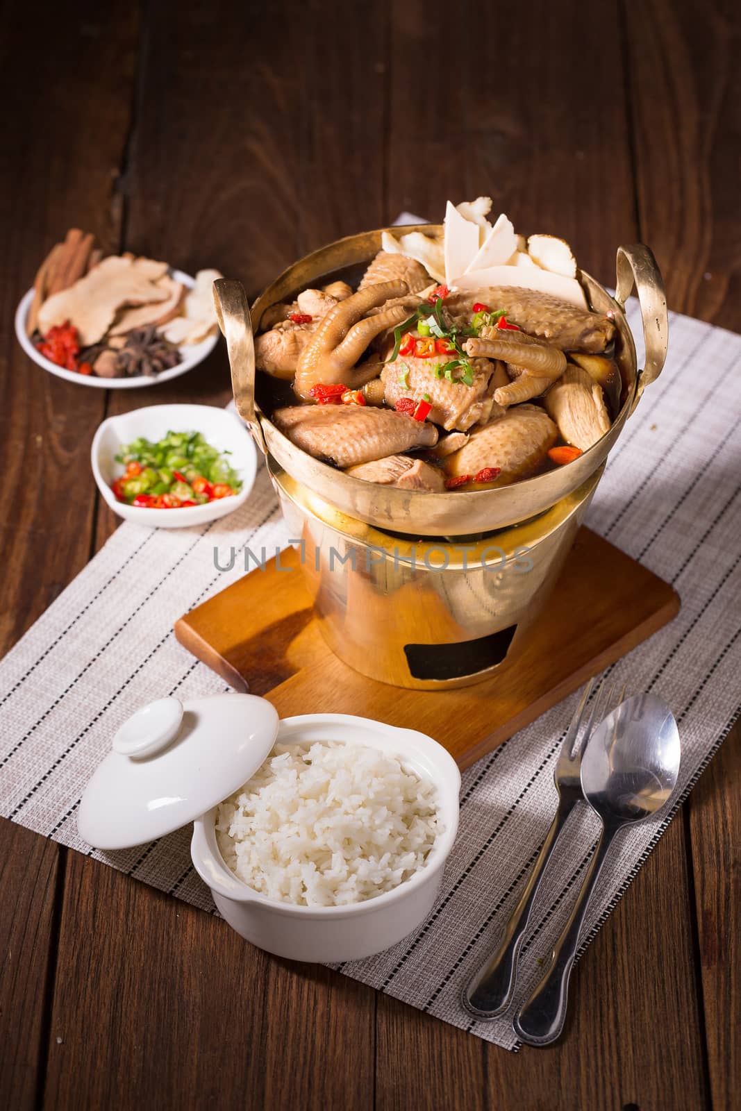 Chicken and herb soup in brass pan by kaiskynet