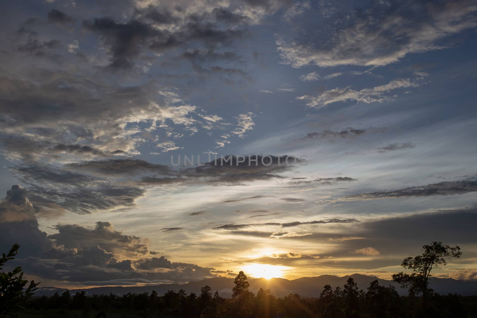 Colorful dramatic sky with cloud at sunset.