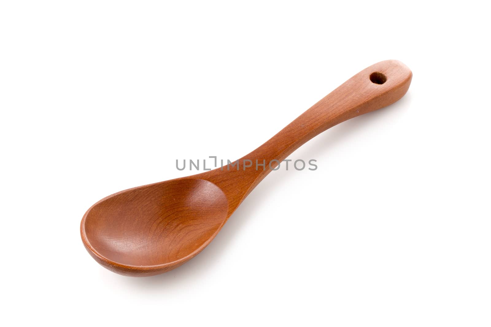 Wooden spoon isolated on a white background.