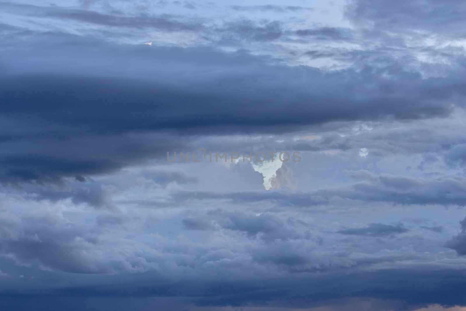 Dramatic sky with stormy clouds before rain and thunderstorm.