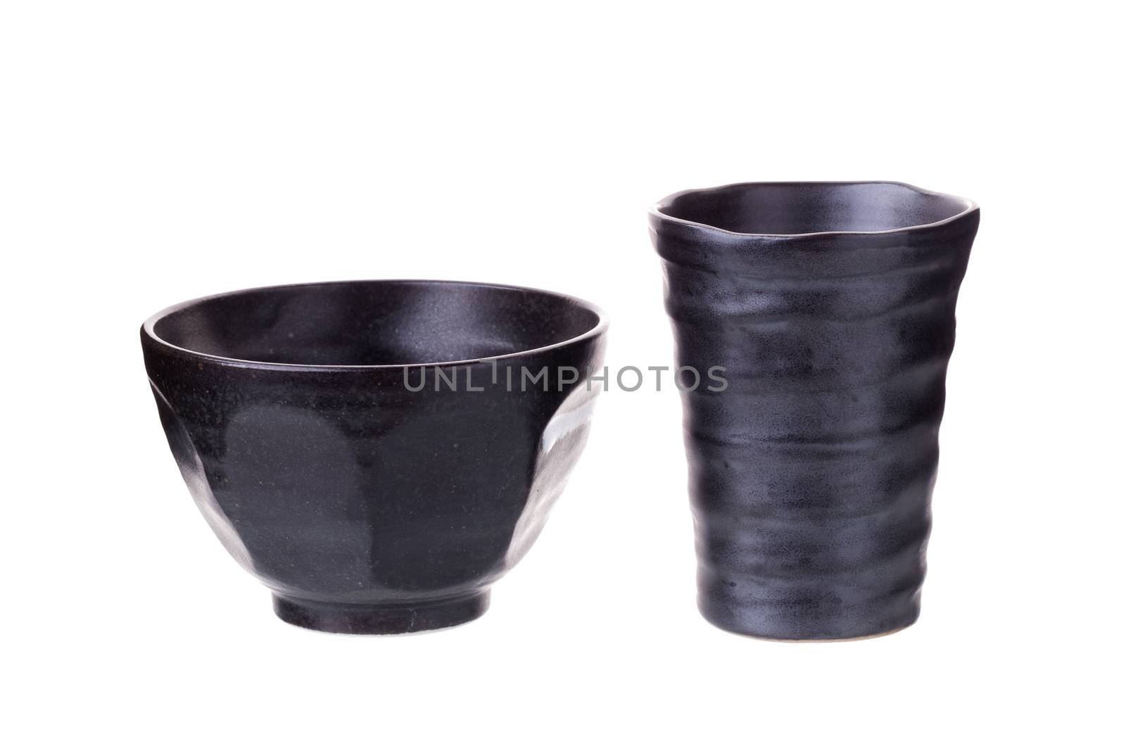 Glass ceramic black and black ceramic bowl on a white background