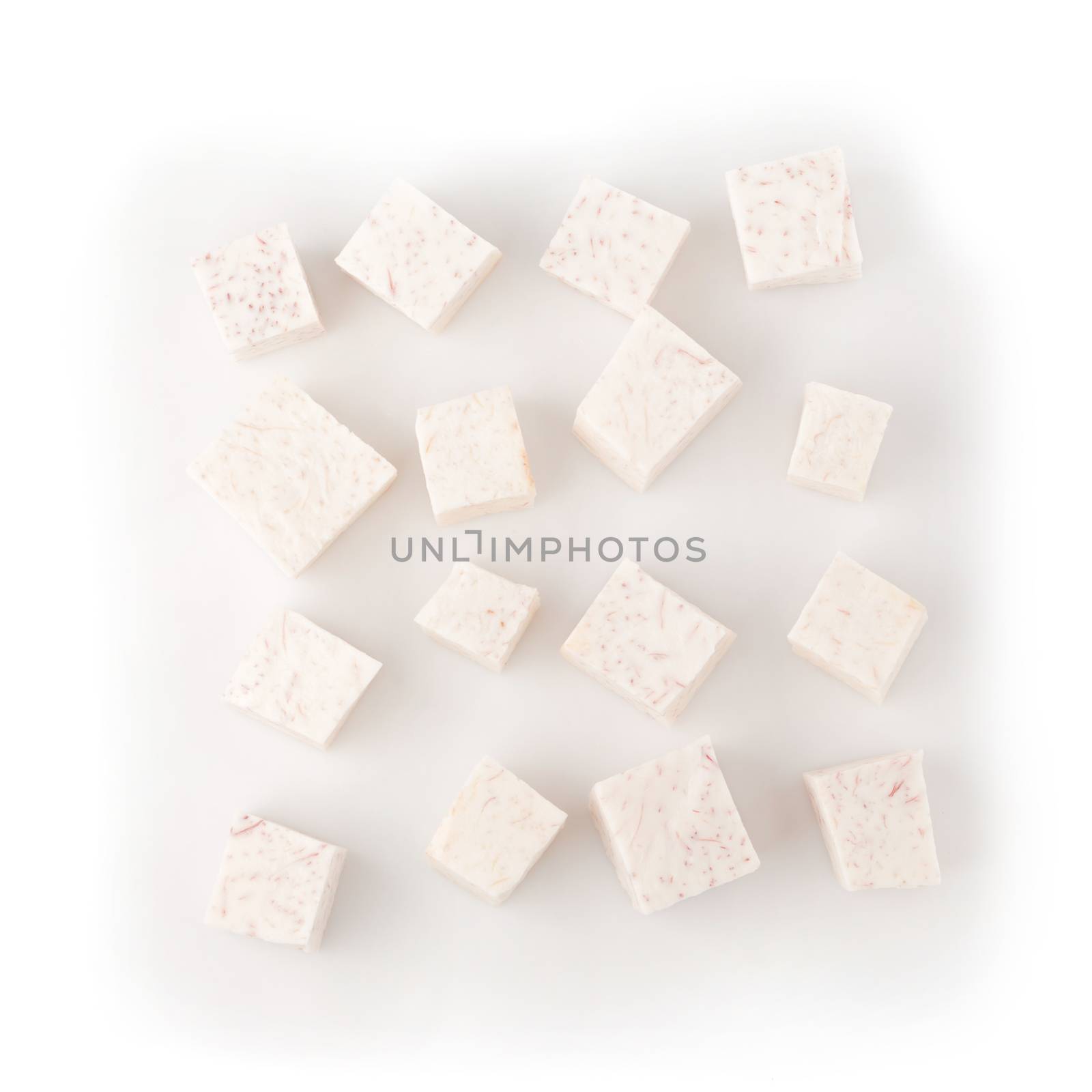 Cube of taro root isolated on a white background.