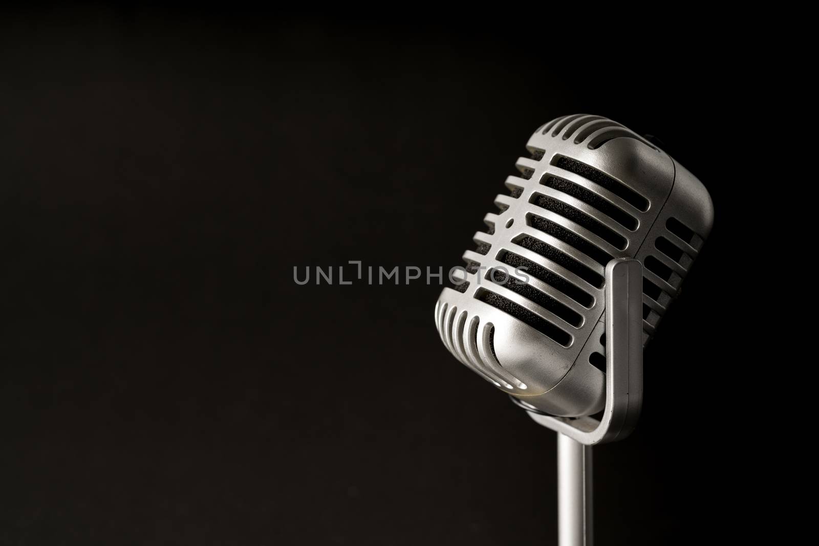 Retro style microphone in party or concert by Alicephoto