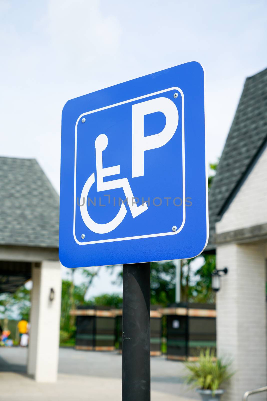 Disabled sign car park at gas station by Alicephoto