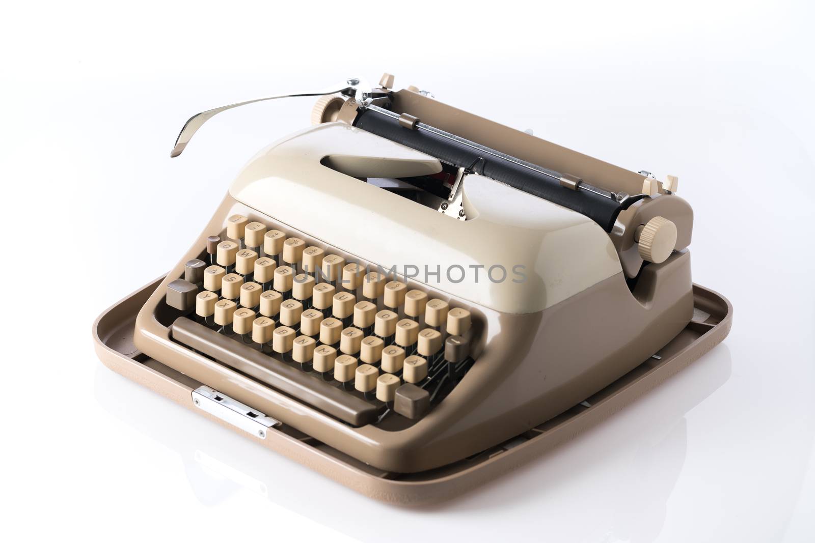 Retro style typewriter in studio by Alicephoto