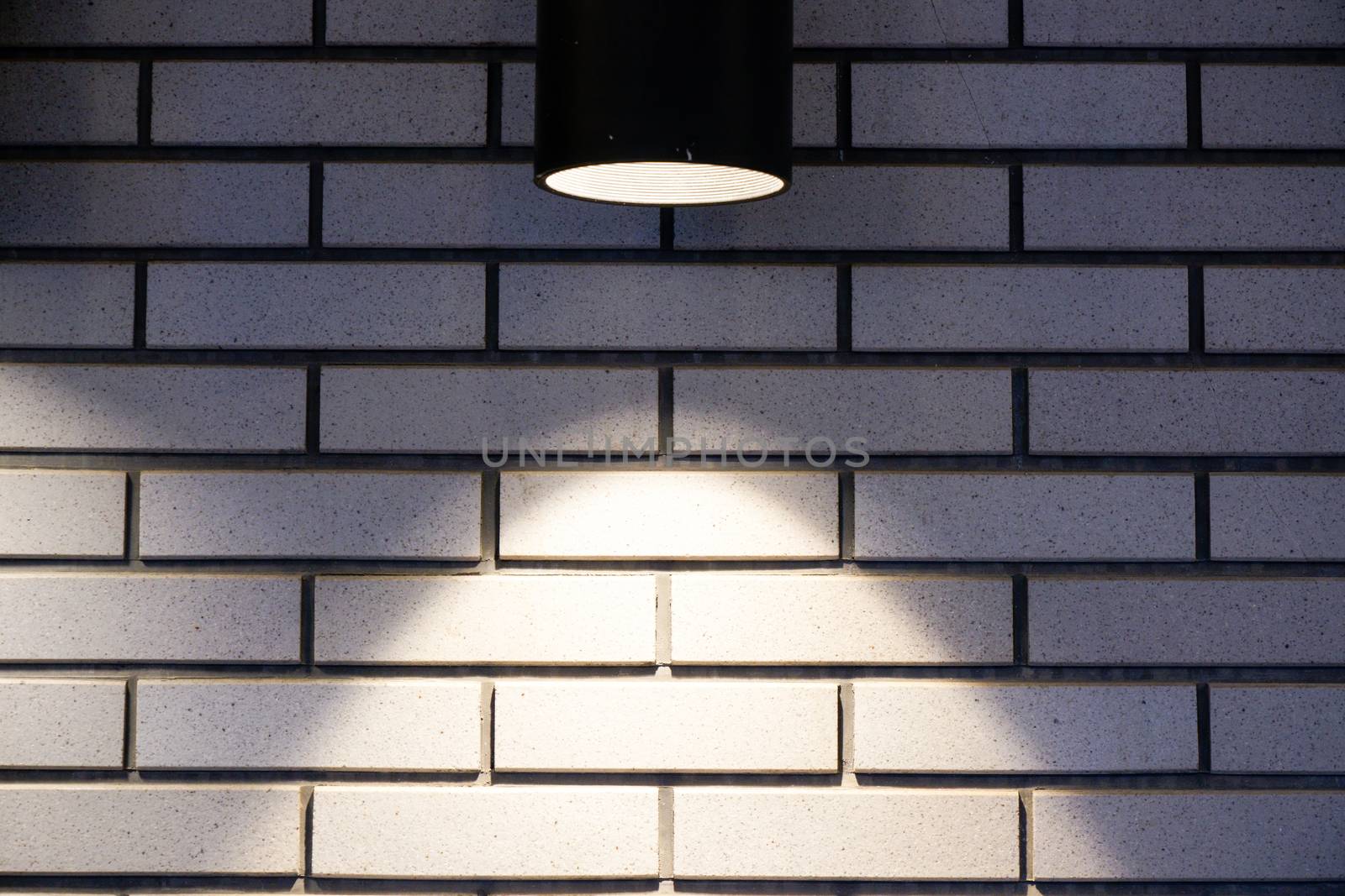 Brick wall with a lamp background