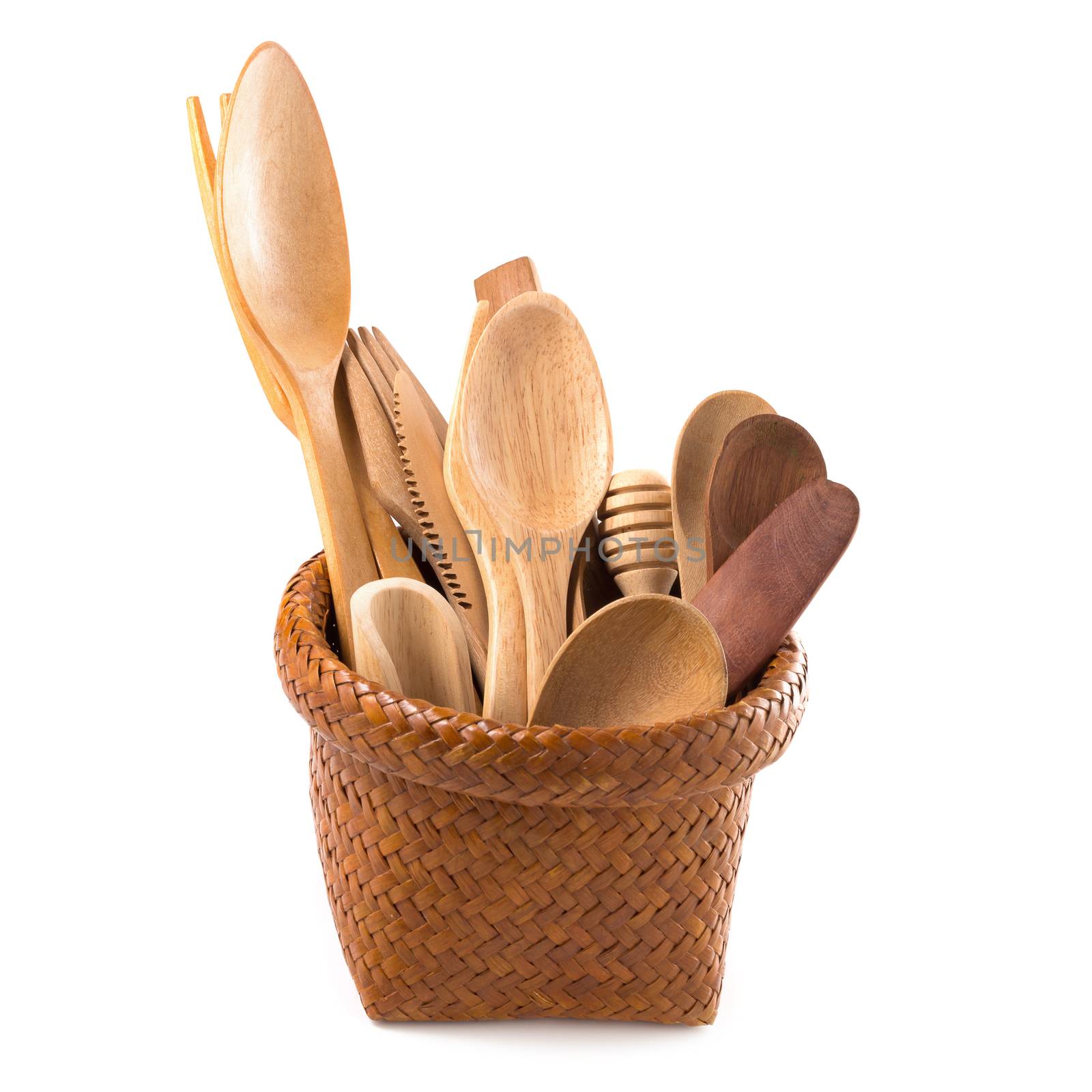 Set of wooden cutlery in Wicker baskets isolated on a white background.