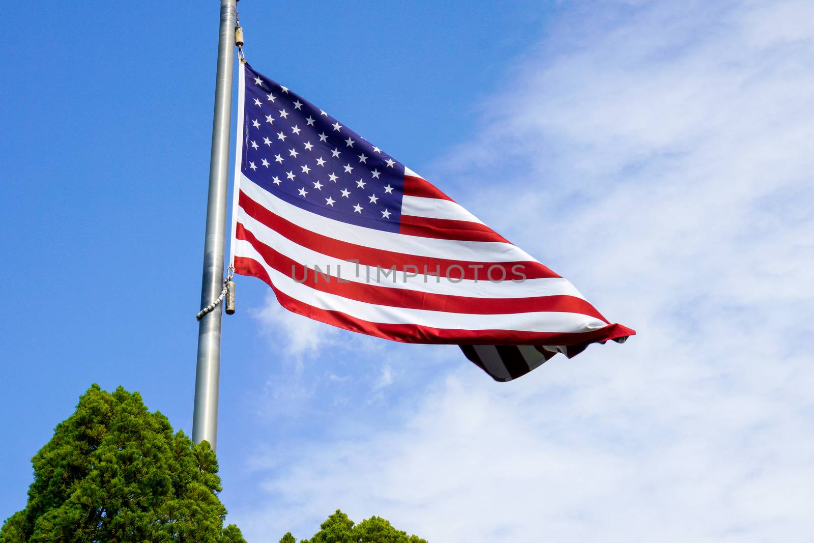 USA flag on the blue sky by Alicephoto