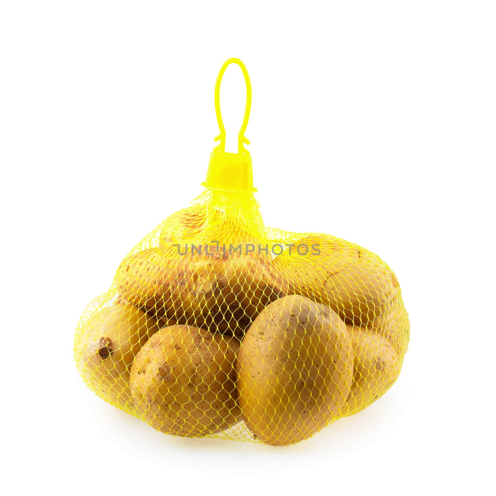 Potatoes are in mesh bag isolated on white background.