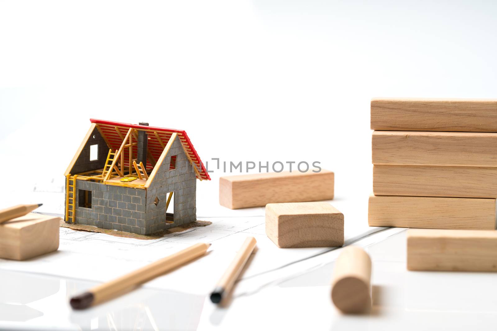 Home & housing estate concept with blueprint by Alicephoto