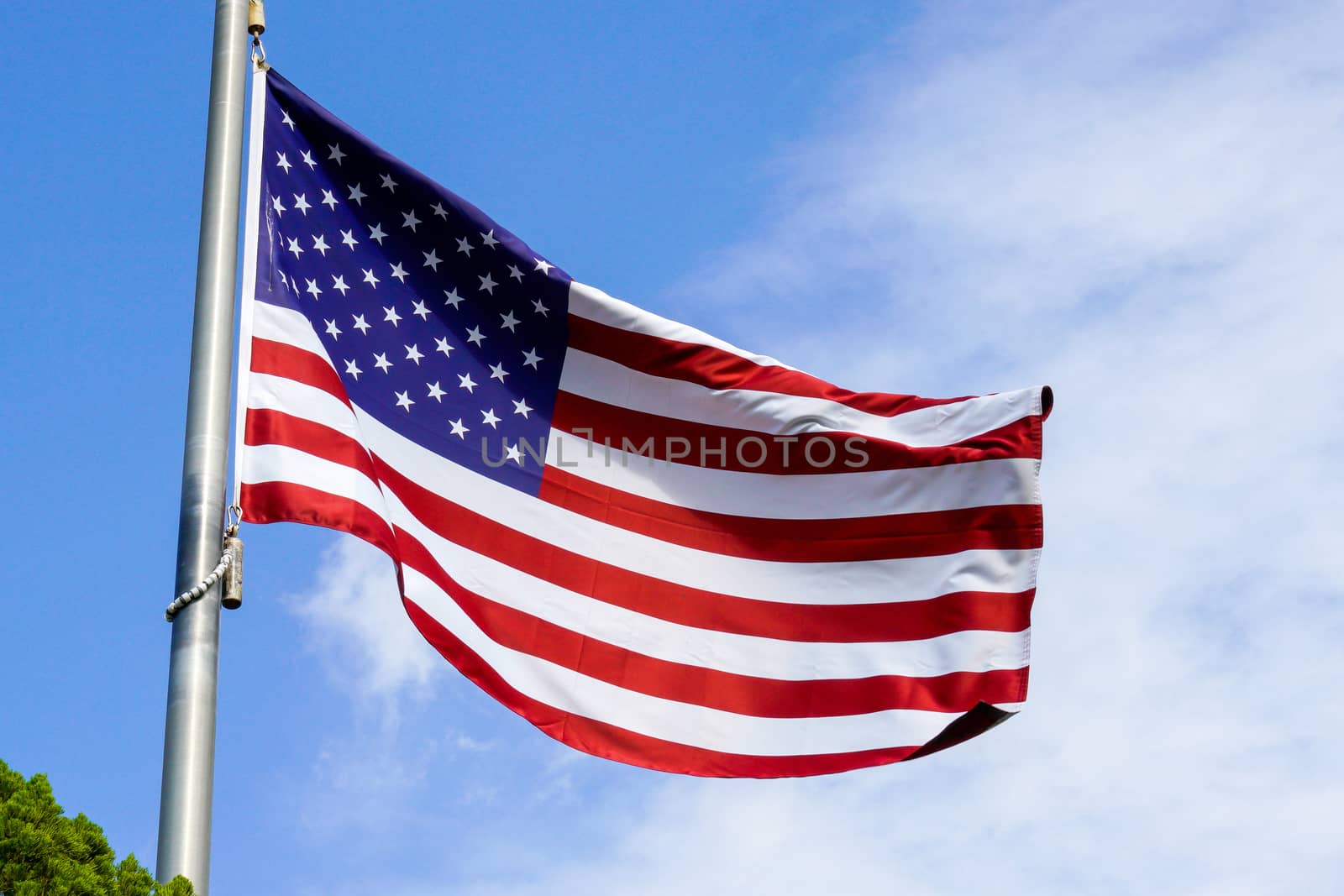 USA flag on the blue sky