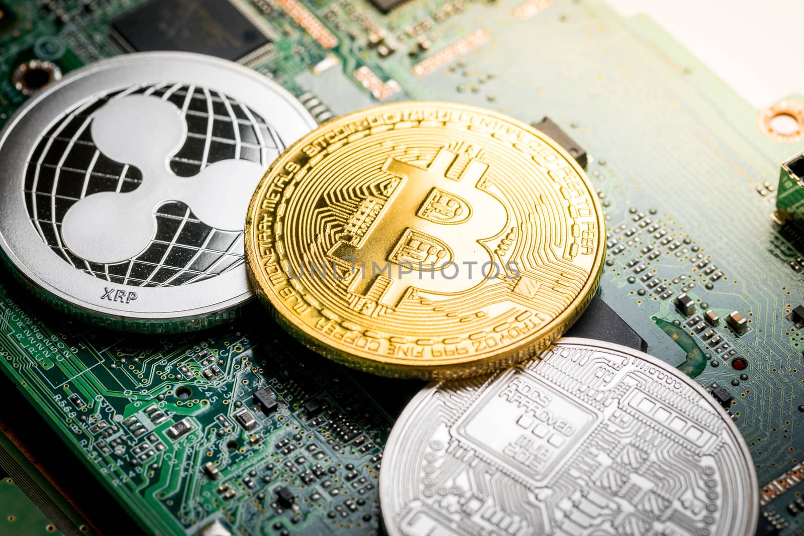 Bitcoin, the digital currency in studio on motherboard backgroun by Alicephoto