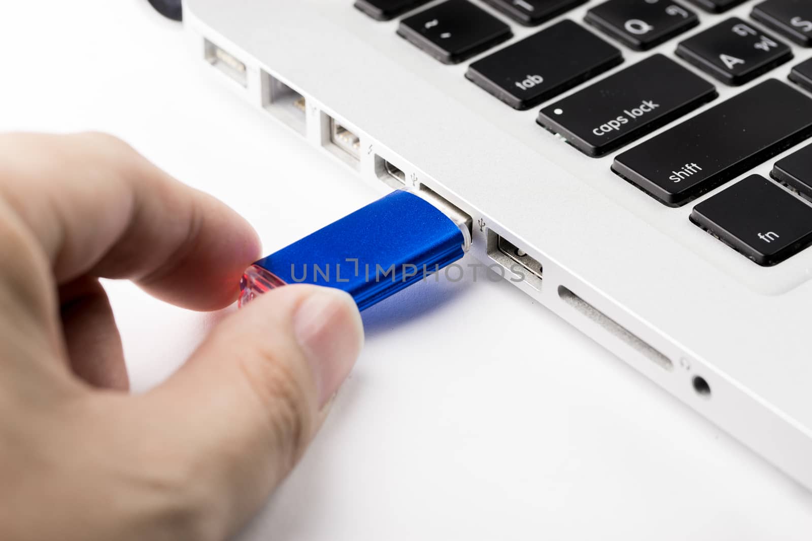 USB Flash drive on computer laptop keyboard