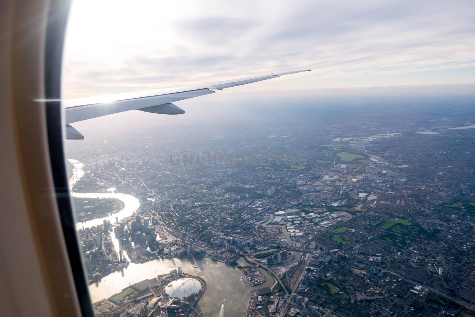 Aerial view of Central London through airplane window by Alicephoto