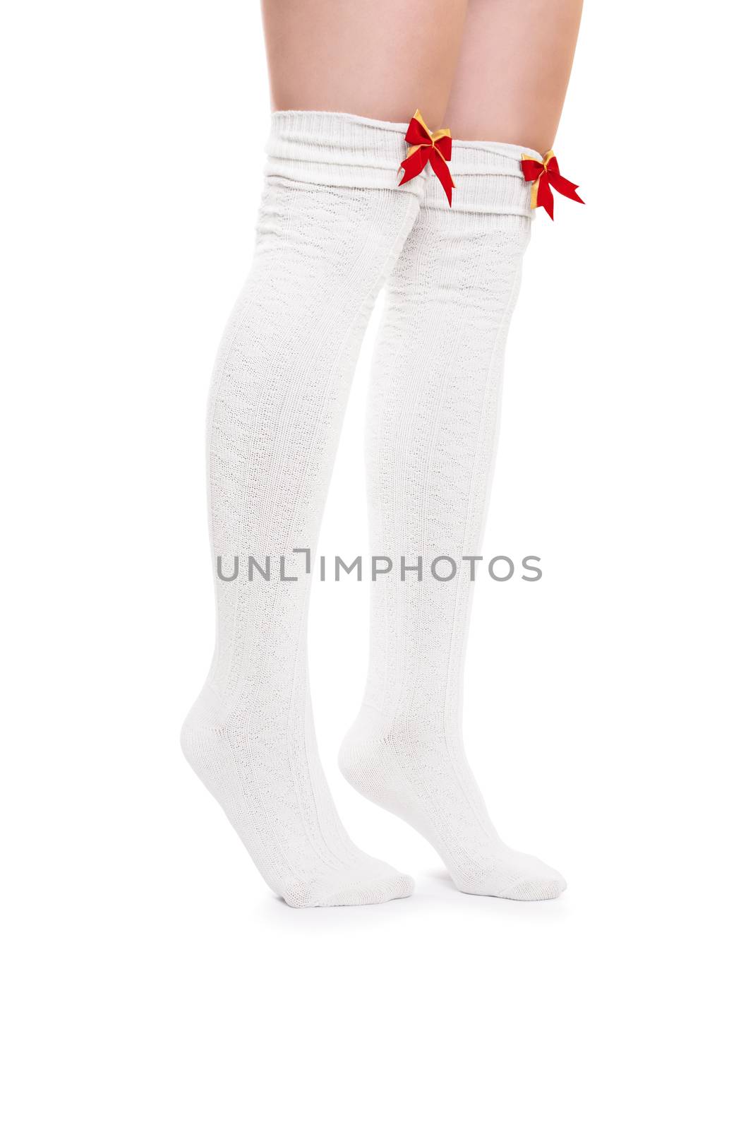 Female legs in white stockings tiptoeing by Mendelex