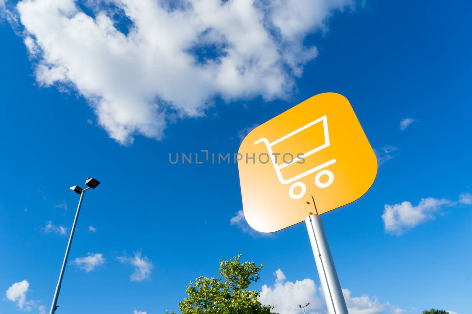 Shopping cart sign outdoor at supermarket by Alicephoto