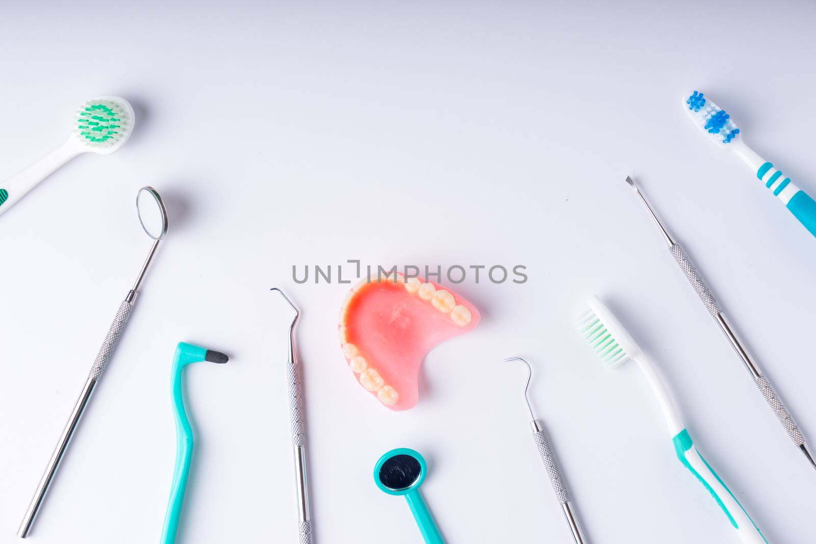 Set of metal Dentist's medical equipment tools, top view by Alicephoto