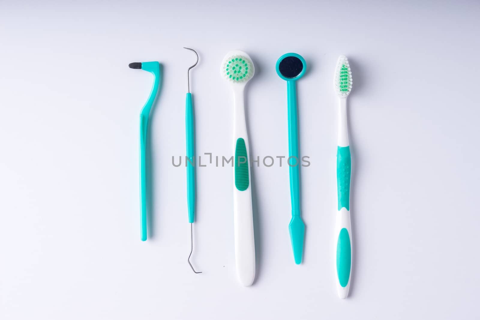 Set of metal Dentist's medical equipment tools, top view by Alicephoto