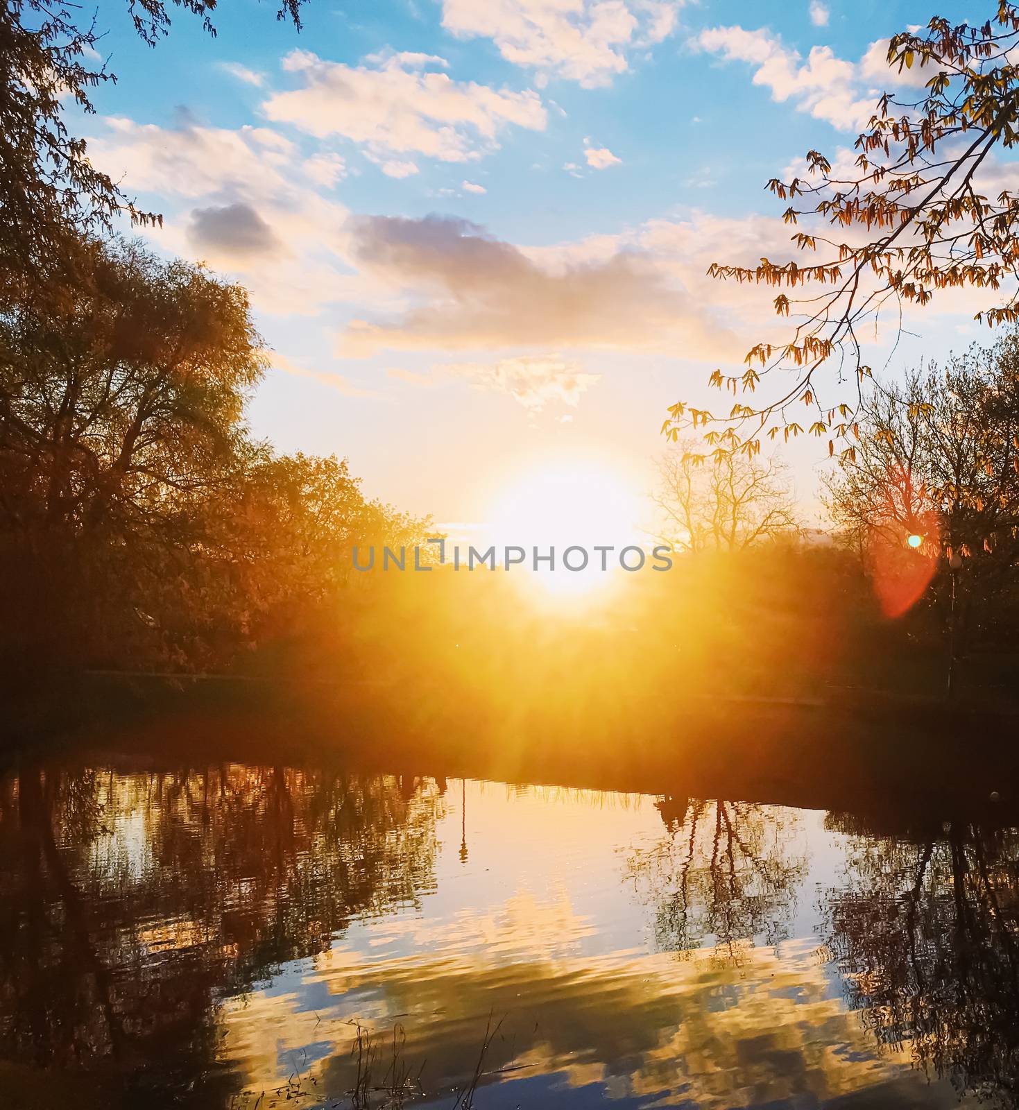 Sunset over the river in spring by Anneleven